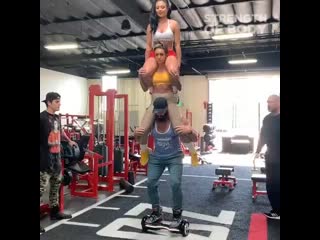 squat with two girls on hoverboard